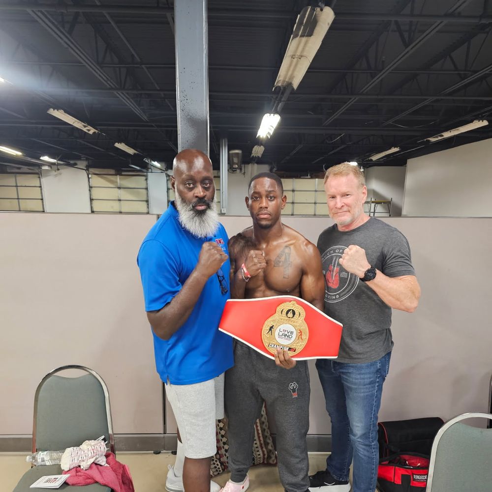 A TOS boxer with his Loveland championship belt