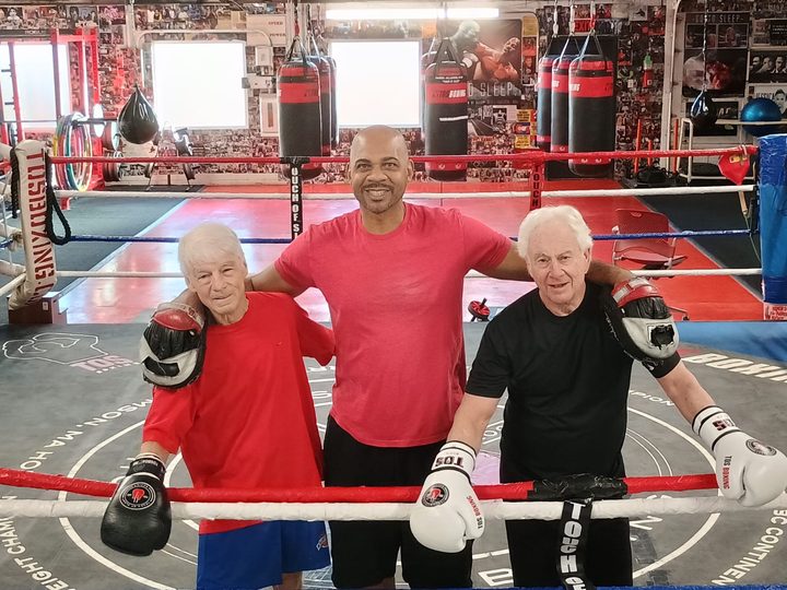 Two boxers over 75 still training in the ring at TOS Boxing