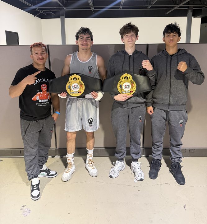 Two TOS boxers with championship belts at Loveland