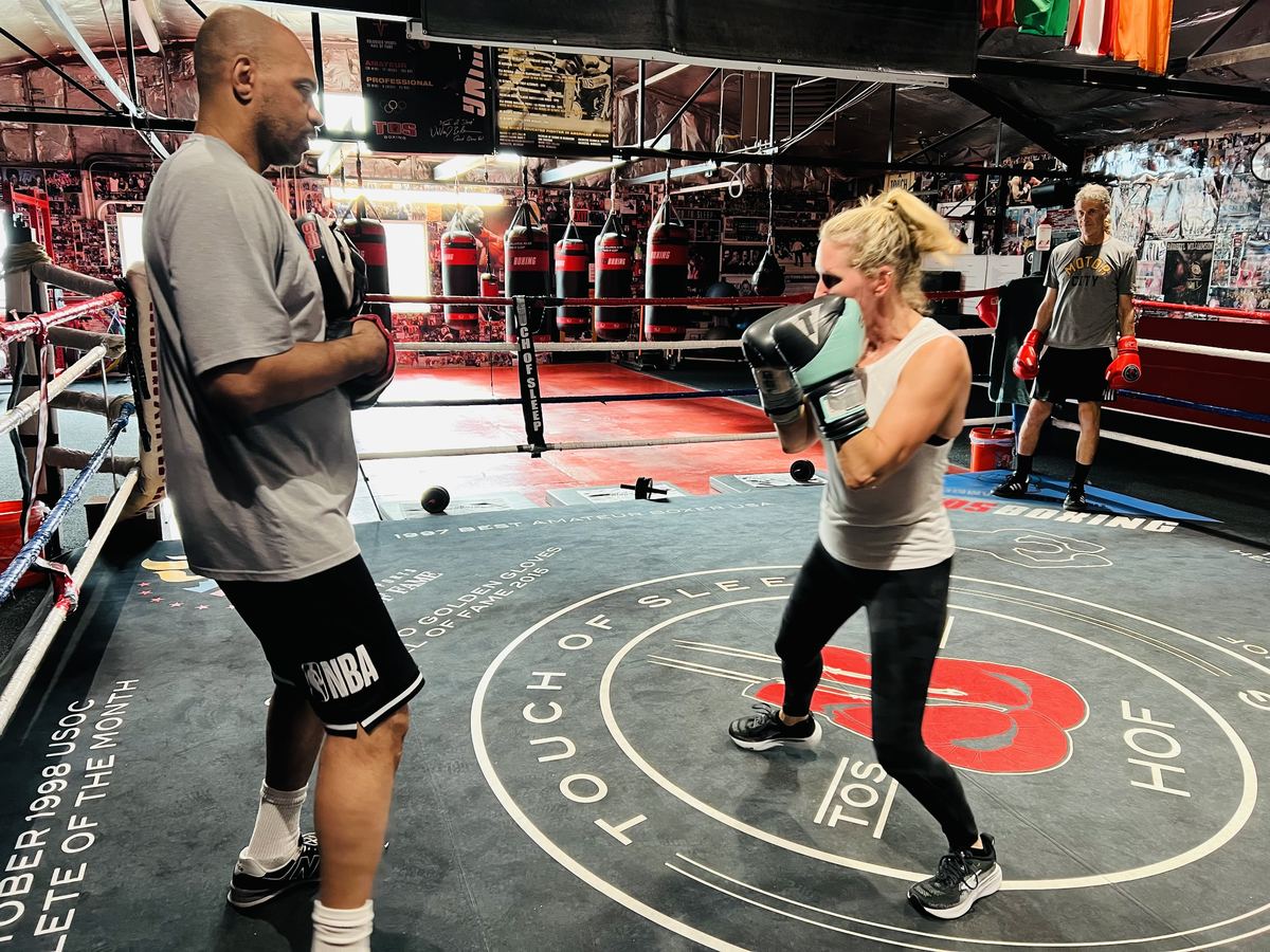 A woman sparring at full speed in the TOS ring